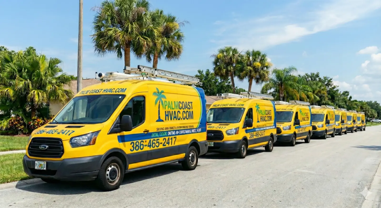Fleet of yellow and blue Palm Coast HVAC R LLC service vans parked on a Palm Coast, Florida street